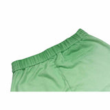 Green straight-leg sweatpants with reverse background technology.