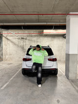 Green reversed background fleece hoodie with anti-bottom frying process.