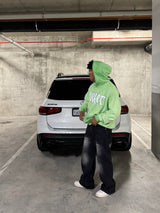 Green reversed background fleece hoodie with anti-bottom frying process.